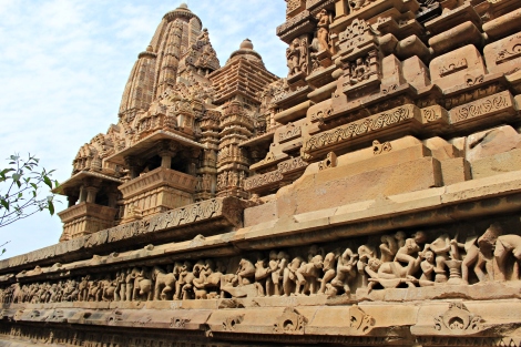 The elaborate carvings on the Adhisthana ranging from Court scenes, War scenes to Extreme Erotic Scenes